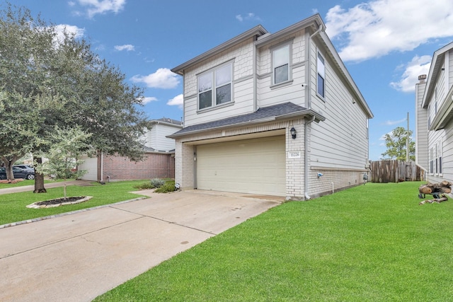 view of front of home with a front yard and a garage