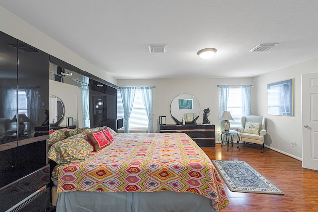 bedroom featuring hardwood / wood-style flooring