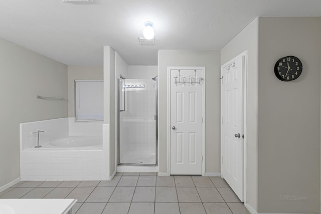 bathroom with tile patterned flooring, shower with separate bathtub, and vanity