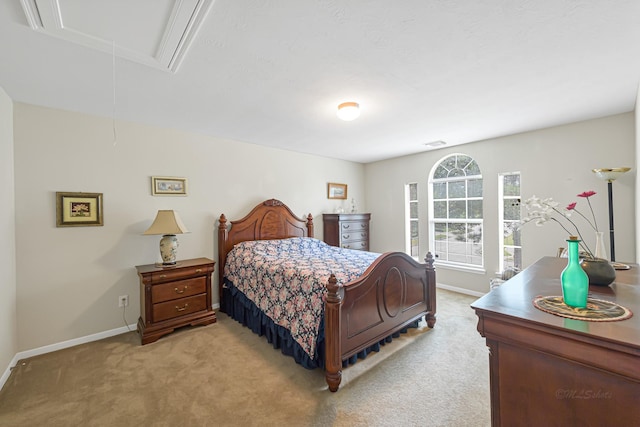 bedroom featuring light carpet