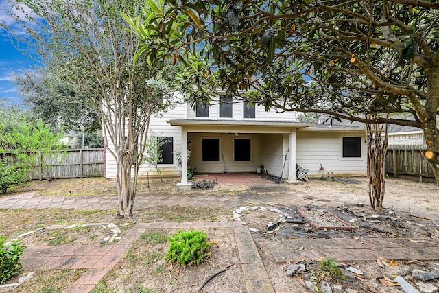 rear view of property featuring a patio area