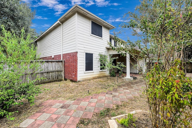 rear view of property featuring a patio area