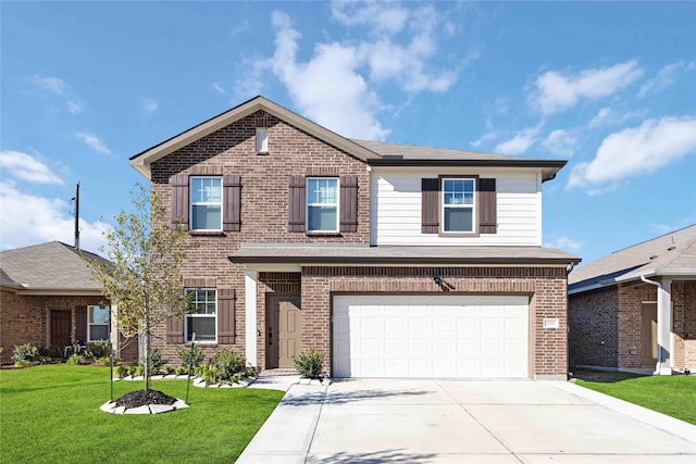 view of front of home featuring a front yard and a garage