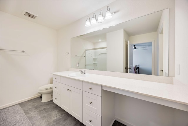 bathroom with toilet, ceiling fan, walk in shower, and vanity