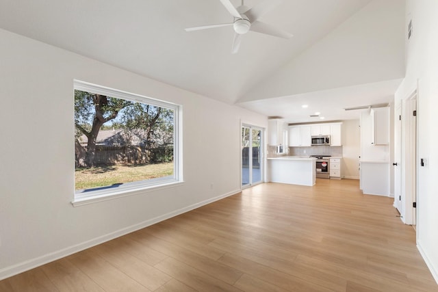 unfurnished living room featuring high vaulted ceiling, light wood-type flooring, and ceiling fan