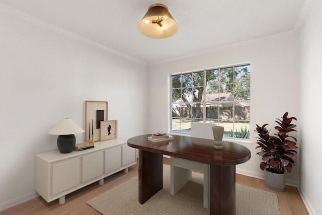 office space with crown molding and light wood-type flooring