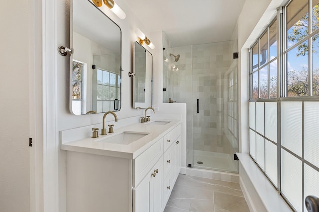 bathroom featuring vanity and an enclosed shower