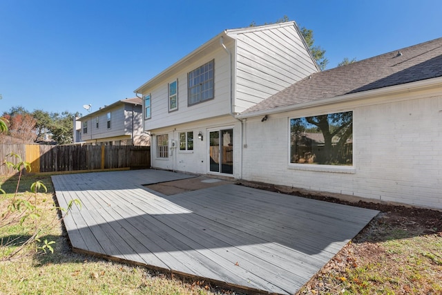 rear view of house featuring a deck