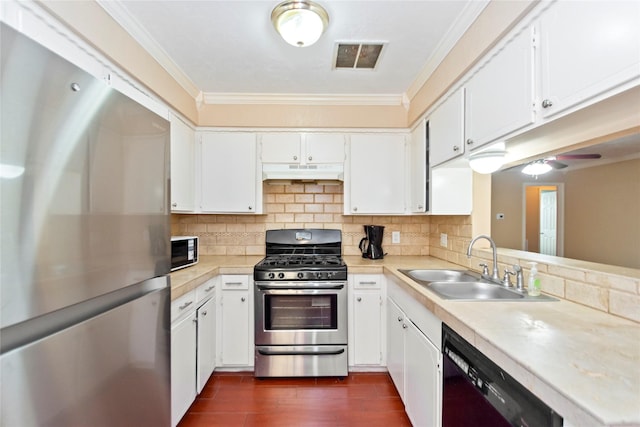 kitchen with black appliances, white cabinetry, ornamental molding, and sink