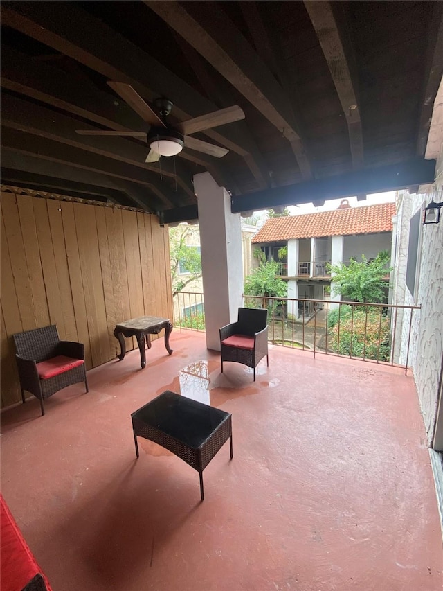 view of patio featuring ceiling fan