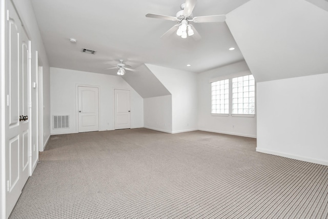 bonus room with ceiling fan, carpet, and lofted ceiling