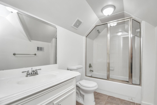 full bathroom featuring tile patterned flooring, vaulted ceiling, toilet, enclosed tub / shower combo, and vanity