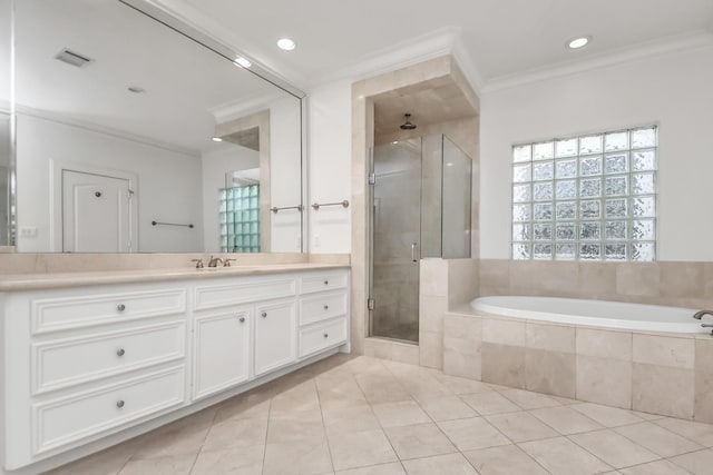 bathroom with vanity, tile patterned floors, crown molding, and plus walk in shower