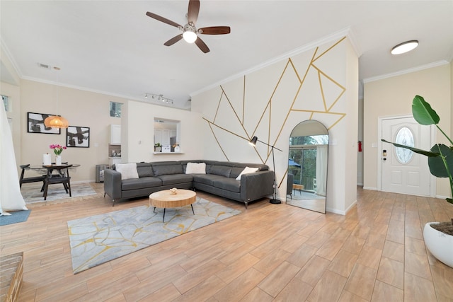 living room featuring ornamental molding, ceiling fan, and track lighting