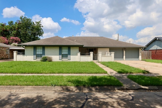 single story home with a garage and a front yard