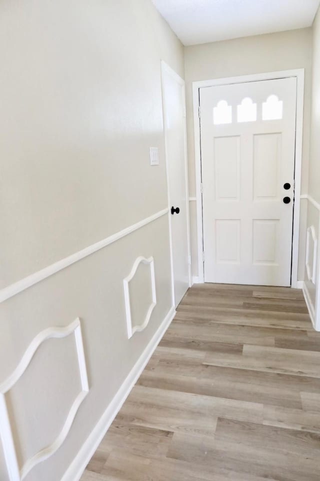 doorway to outside with light hardwood / wood-style flooring