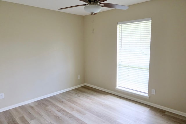 spare room with ceiling fan and light hardwood / wood-style flooring