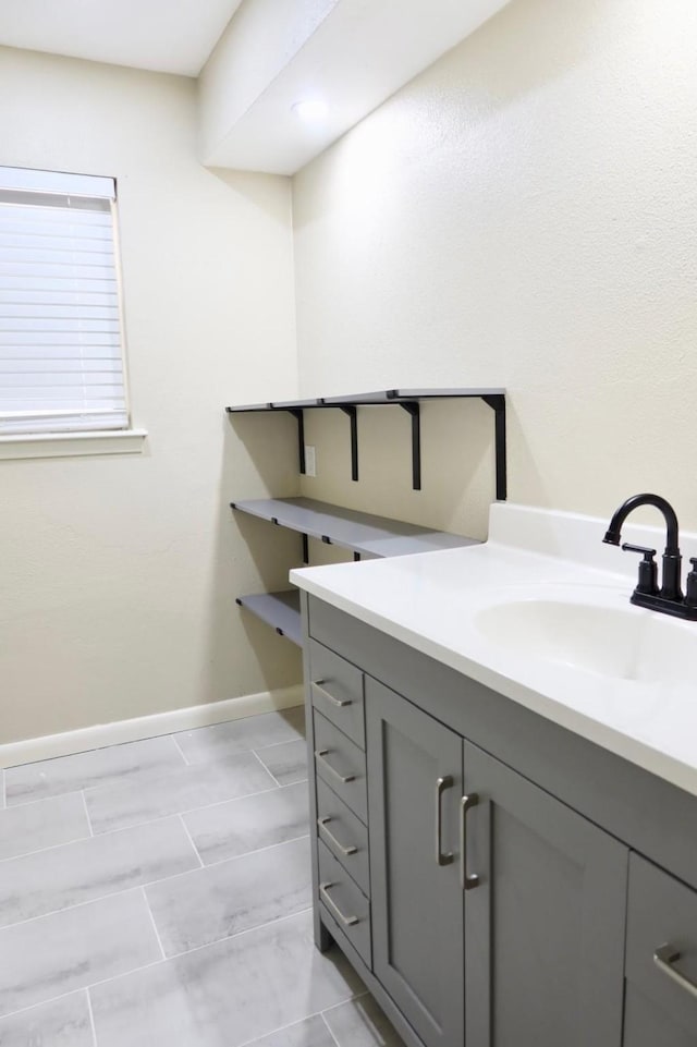 bathroom featuring tile patterned flooring and vanity