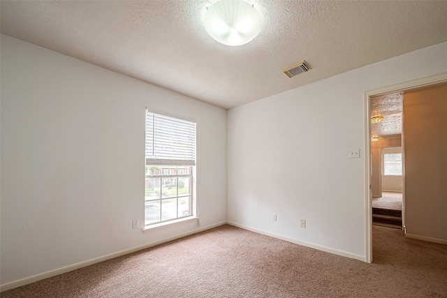 unfurnished room featuring carpet flooring