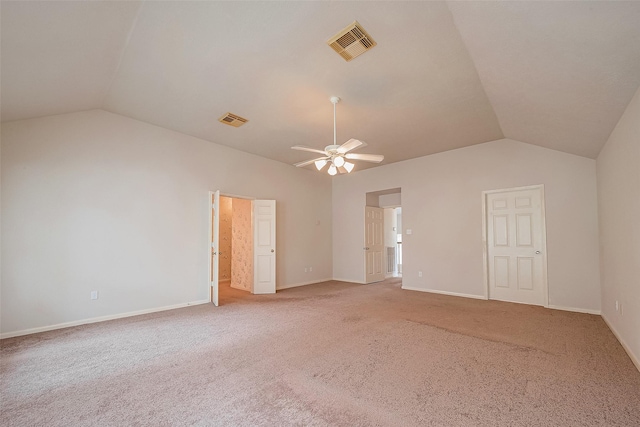 carpeted empty room with lofted ceiling and ceiling fan