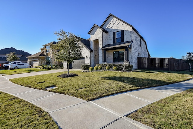 view of front facade featuring a front yard and a garage