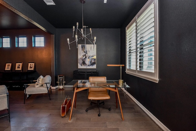 office featuring an inviting chandelier and hardwood / wood-style flooring