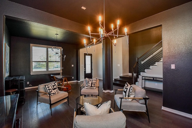 living room featuring a chandelier and dark hardwood / wood-style floors