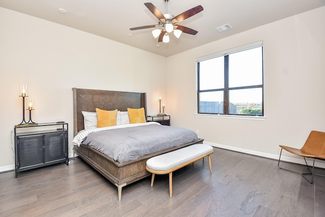 bedroom with ceiling fan and hardwood / wood-style flooring