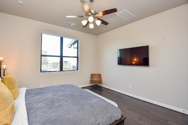 bedroom featuring ceiling fan and dark wood-type flooring