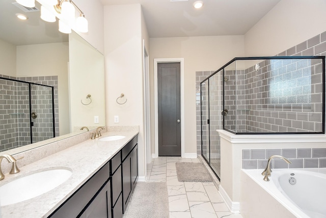 bathroom featuring vanity and separate shower and tub