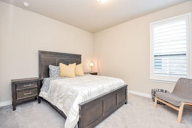 bedroom with light colored carpet