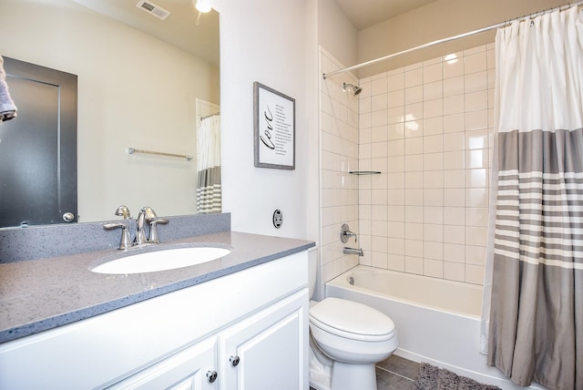 full bathroom with toilet, vanity, tile patterned floors, and shower / bath combination with curtain