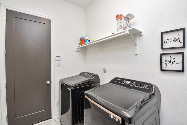 washroom featuring washer and dryer