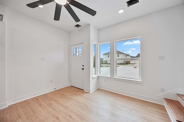 entryway featuring light wood-type flooring and ceiling fan