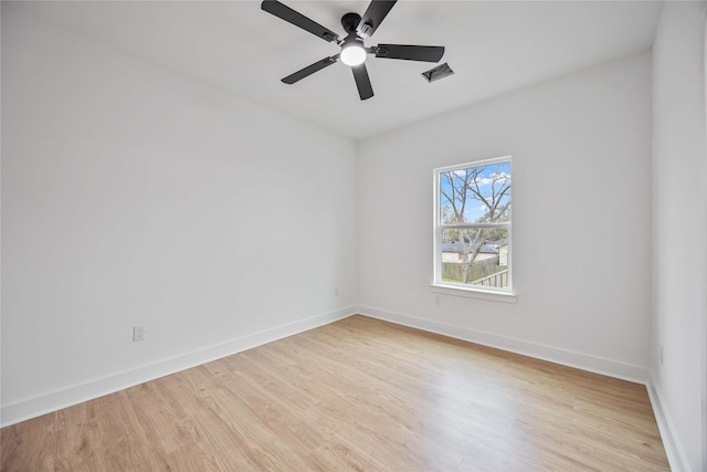 spare room with ceiling fan and light hardwood / wood-style floors