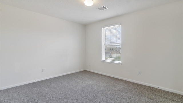 unfurnished room featuring carpet flooring