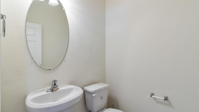 bathroom with sink and toilet