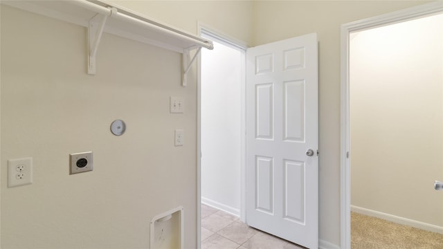 washroom featuring light tile patterned flooring and hookup for an electric dryer