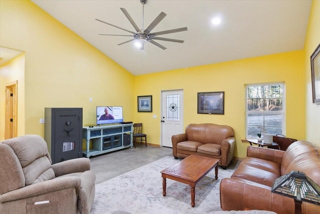 living room with ceiling fan and high vaulted ceiling