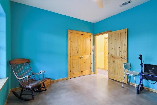 living area featuring concrete floors