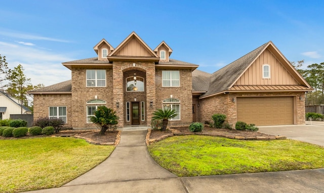 view of front of home featuring a front lawn and a garage