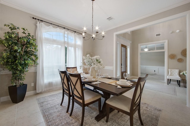 dining room featuring ceiling fan with notable chandelier, ornamental molding, and light tile patterned flooring