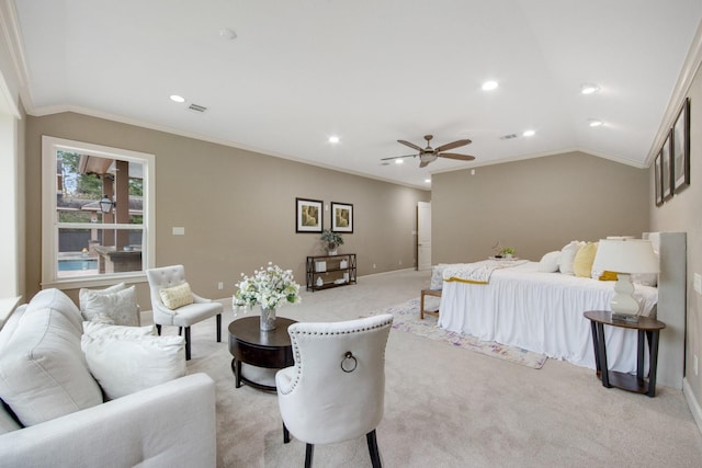 carpeted bedroom with ceiling fan, crown molding, and vaulted ceiling