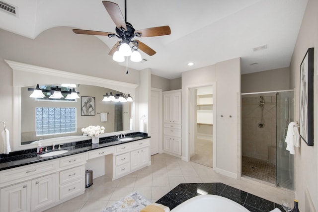 bathroom featuring ceiling fan, vanity, separate shower and tub, and tile patterned flooring