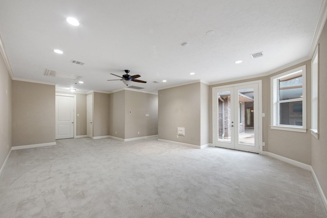 empty room with ceiling fan, a wealth of natural light, crown molding, and french doors