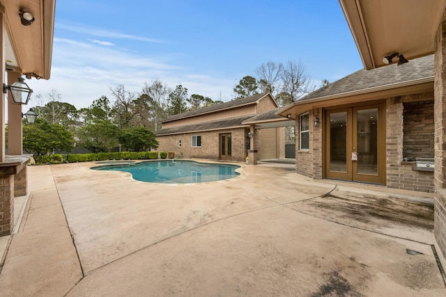 view of pool featuring french doors and a patio