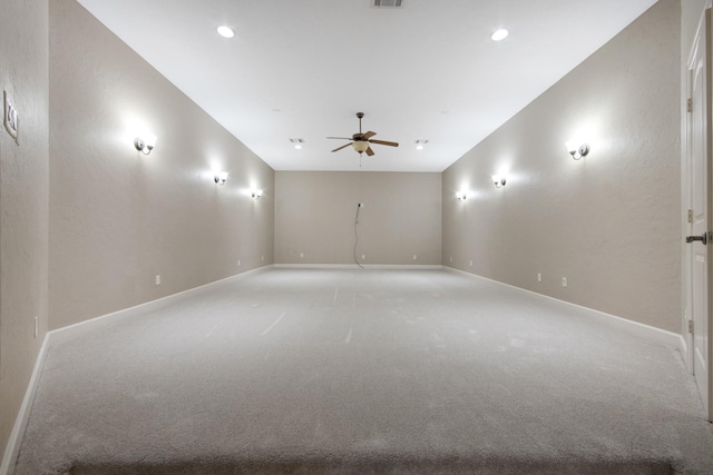 unfurnished room featuring ceiling fan and light colored carpet