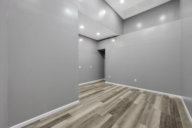 unfurnished room with light wood-type flooring