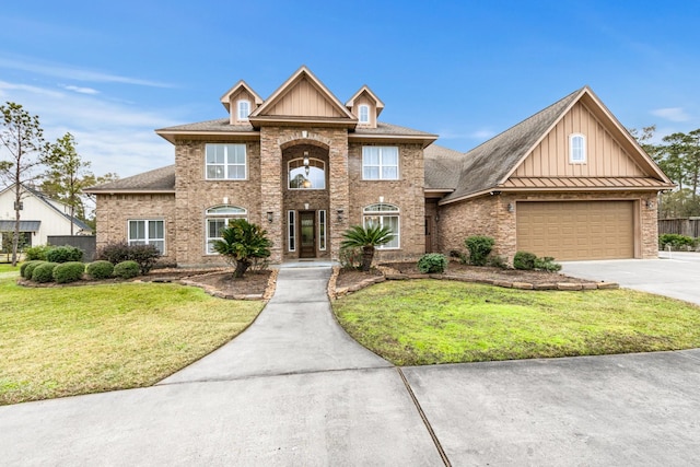 view of front of property featuring a front lawn and a garage