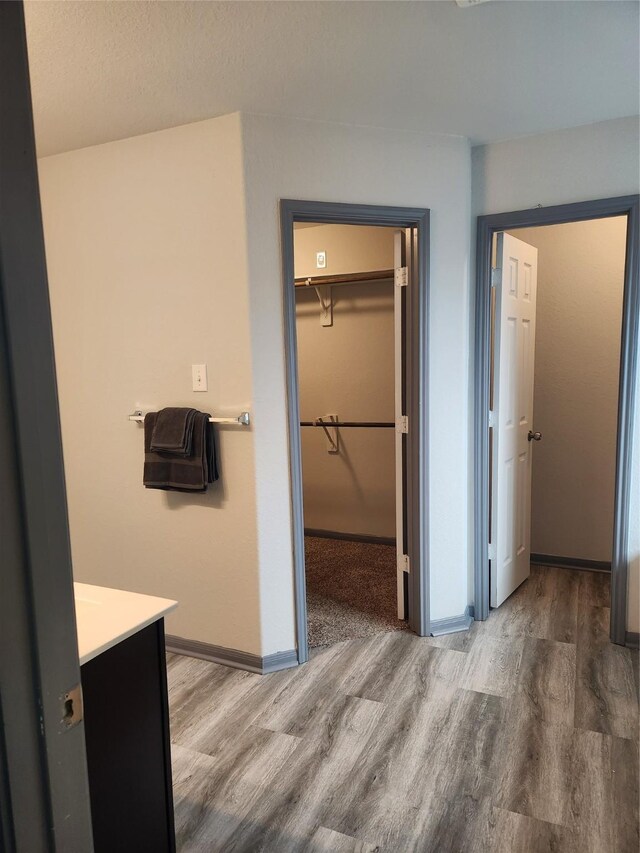 bathroom with vanity and hardwood / wood-style floors